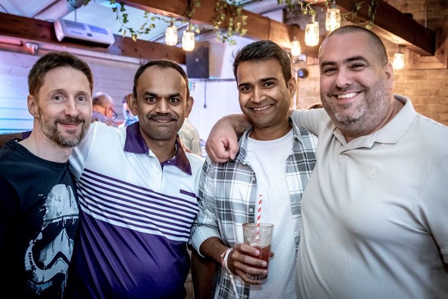 Four workers at gathering